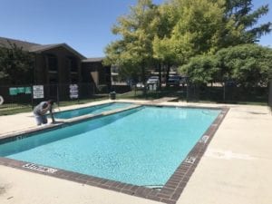 Apartment pool being cleaned