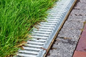 A backyard drain near the patio. 