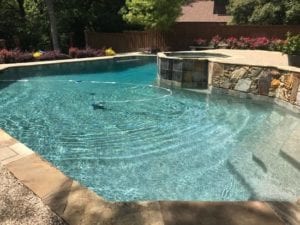 a pool getting its weekly cleaning