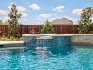 a pool with an attached spa