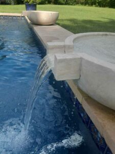 up close photo of a water feature for a pool