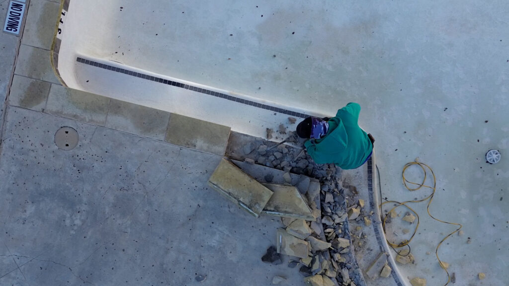 Aerial shot of Pool construction worker
